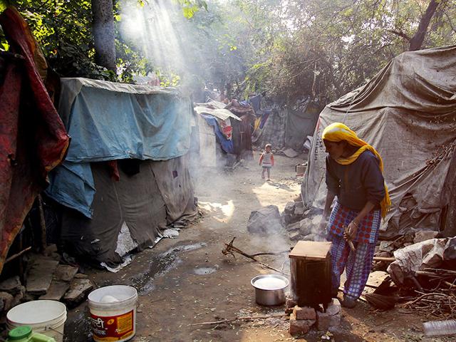 Sakina Bibi, 40, who is from Badarpur, lives in her shanty near Nizamuddin with her husband and one son. According to Sakina, her husband earns too little as a rickshaw puller to arrange even two meals a day, living in a proper house is beyond imagination. (Subrata Biswas/HT Photo)