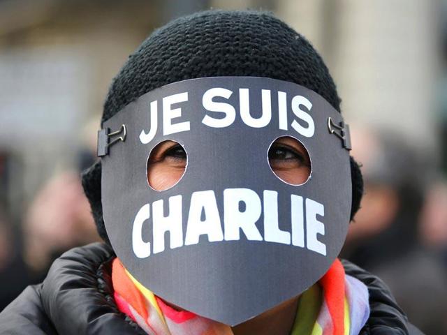 A woman wearing a mask reading 'I am Charlie' takes part in a solidarity march (Marche Republicaine) in the streets of Paris. (Reuters Photo)