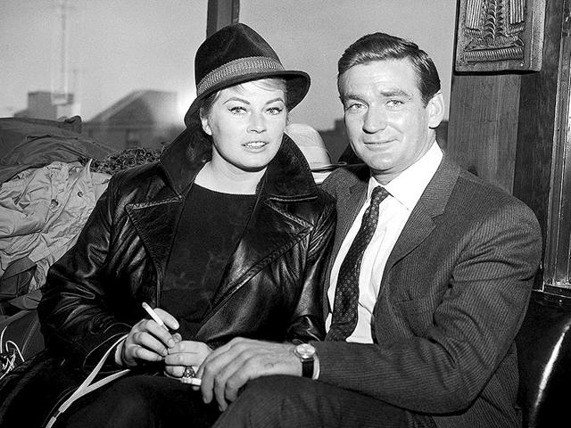 In this May 9, 1962 photo, Swedish actor Anita Ekberg and Australian-American actor Rod Taylor, who plan to marry soon, in San Francisco, United States. Anita Ekberg, the Swedish-born actor and sex-symbol of the 1950s and '60s who was immortalized bathing in the Trevi fountain in La Dolce Vita, has died. She was 83. Ekberg's lawyer Patrizia Ubaldi confirmed her death Sunday, January 11, 2015. (AP)