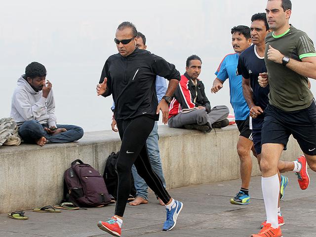 Reliance Group chairman Anil Ambani practises ahead of the Mumbai Marathon on Marine Drive in Mumbai. (Arijit Sen/HT photo)