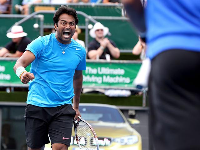 Leander Paes and Raven Klaasen (R) celebrate winning against Dominic Inglot of Britain and Florin Mergea of Romania during their men's doubles final match at the Auckland Open tennis tournament in Auckland. (AFP Photo)