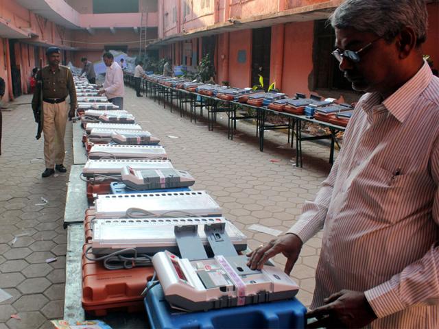 Electronic voting machines being checked ahead of civic polls at Nehru Stadium in Indore on Tuesday. (Shankar Mourya/HT photo)