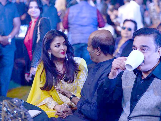 Aishwarya Rai Bachchan talks to Rajinikanth as Kamal Haasan watches the felicitation of Ilaiyaraaja was honoured at the music launch of Shamitabh, the movie that marks the music composer's 1000th venture. (Photo: ShamitabhTheMovie/Facebook) Aishwarya Rai Bachchan talks to Rajinikanth as Kamal Haasan watches the felicitation of Ilaiyaraaja was honoured at the music launch of Shamitabh, the movie that marks the music composer's 1000th venture. (Photo: ShamitabhTheMovie/Facebook)