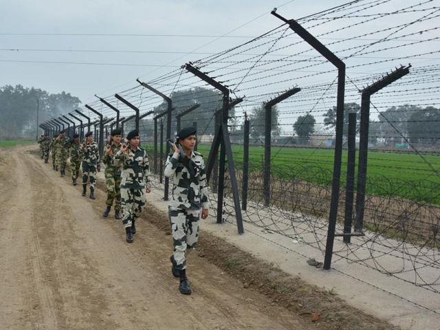 BSF jawans patrolling along the Indo-Pak international border in Amritsar on Wednesday. Sameer Sehgal/HT