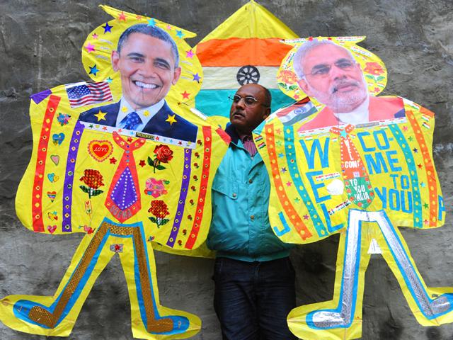 A-kitemaker-poses-with-kites-adorned-with-images-of-US-President-Barack-Obama-and-Prime-Minister-Narendra-Modi-in-Amritsar-AFP-photo