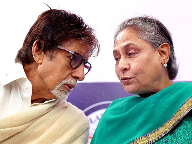 Amitabh Bachchan and Jaya Bachchan caught in sharing a candid moment at the launch of an advance technology in eye care in Mumbai on Wednesday. (PTI Photo)