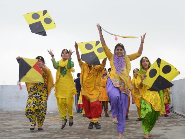 Excited students celebrating Basant Panchmi at their school in Amritsar on Friday. Sameer Sehgal/HT