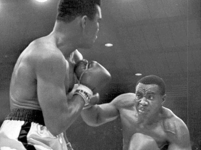 Sonny, right, lands a blow on Ali in the first moments of the fight. Given the controversial way the bout ended, the boxers' gloves were seized by George Russo, the boxing commissioner for Maine. The gloves remained in the Russo family until they were purchased several years ago by a California collector who is now selling them. (Text and Photo: AP) Sonny, right, lands a blow on Ali in the first moments of the fight. Given the controversial way the bout ended, the boxers' gloves were seized by George Russo, the boxing commissioner for Maine. The gloves remained in the Russo family until they were purchased several years ago by a California collector who is now selling them. (Text and Photo: AP)