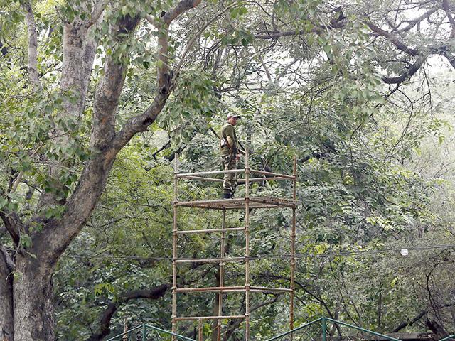 A security personnel guards on a stand installed near the hotel where US President Barack Obama is expected to stay, in New Delhi. (Reuters Photo)