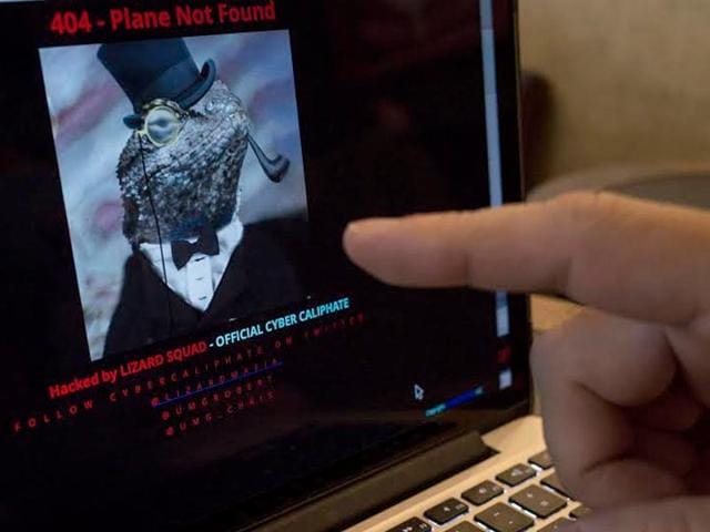 A-man-points-at-the-computer-screen-showing-Malaysia-Airlines-hacked-website-at-a-cafe-in-Petaling-Jaya-outside-Kuala-Lumpur-Malaysia-The-airline-s-site-was-changed-on-Monday-at-first-with-a-message-saying-404-Plane-Not-Found-and-that-it-was-Hacked-by-Cyber-Caliphate-The-browser-tab-for-the-website-said-ISIS-will-prevail-AP-Photo