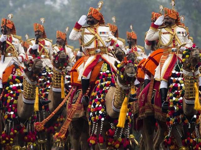 Military personnel salute while riding camels during Republic Day Parade in New Delhi. (AFP Photo) Military personnel salute while riding camels during Republic Day Parade in New Delhi. (AFP Photo)