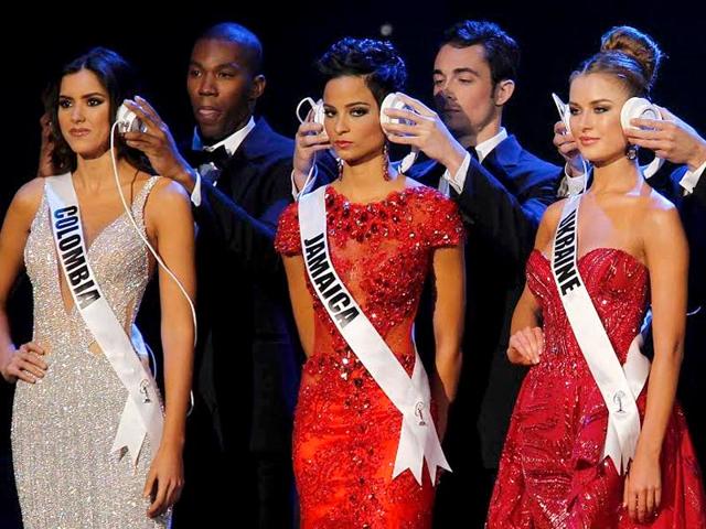 Miss Colombia Paulina Vega, the eventual winner, Miss Jamaica Kaci Fennell, and Miss Ukraine Diana Harkusha, who finished third, are seen with headphones during a question phase. (Reuters) Miss Colombia Paulina Vega, the eventual winner, Miss Jamaica Kaci Fennell, and Miss Ukraine Diana Harkusha, who finished third, are seen with headphones during a question phase. (Reuters)