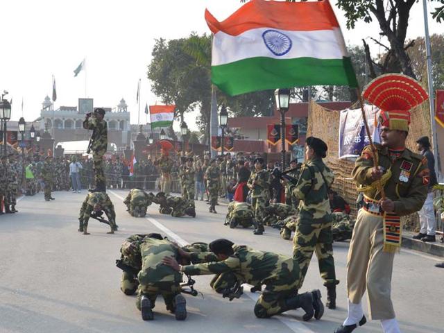 BSF jawans performs during the retreat ceremony at Attari-Wagah joint check post in Amritsar on Sunday. Sameer Sehgal/HT