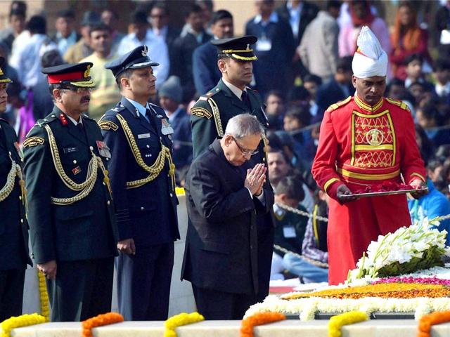 President Pranab Mukherjee pays tribute to Mahatma Gandhi on his death anniversary at Rajghat in New Delhi. (PTI Photo)