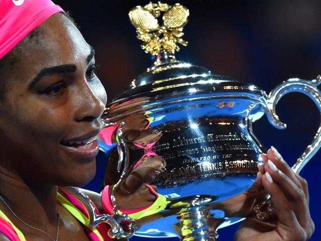 Serena Williams holds up the trophy after beating Maria Sharapova in the 2015 Australian Open women's singles final in Melbourne. (AFP Photo)