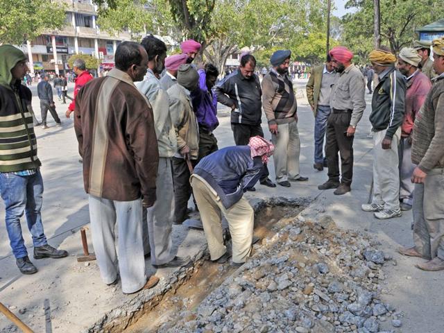 MC-workers-digging-up-the-floor-of-the-Sector-17-Plaza-to-check-the-quality-of-pipes-in-Chandigarh-on-Monday-Gurpreet-Singh-HT