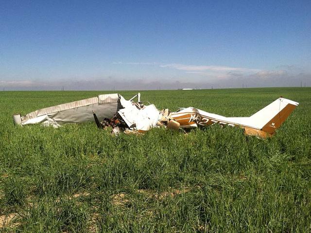 The-wreckage-of-a-crashed-Cessna-150-airplane-lies-in-a-field-near-Watkins-Colorado-Reuters-Photo