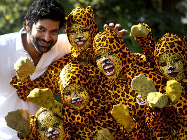 Actor Purab Kohli poses with kids dressed as tigers during the 'Kids for Tiger' festival, a commitment to tiger conservation, at Maharashtra Nature Park in Mumbai. (Arijit Sen/HT photo)