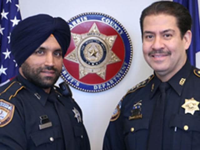 Patrol-deputy-Sandeep-Singh-Dhaliwal-with-Sheriff-Adrian-Garcia-HCSO-Photo-Sikh24-com