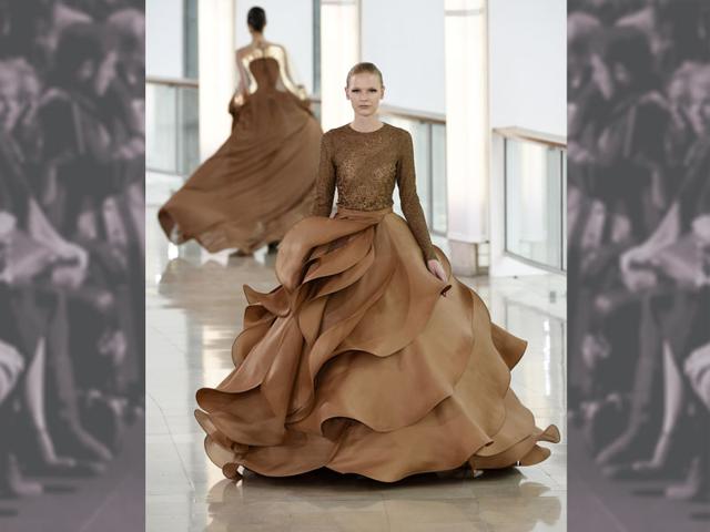 Graceful undulating ruffles, swirling rose petals at Stéphane Rolland