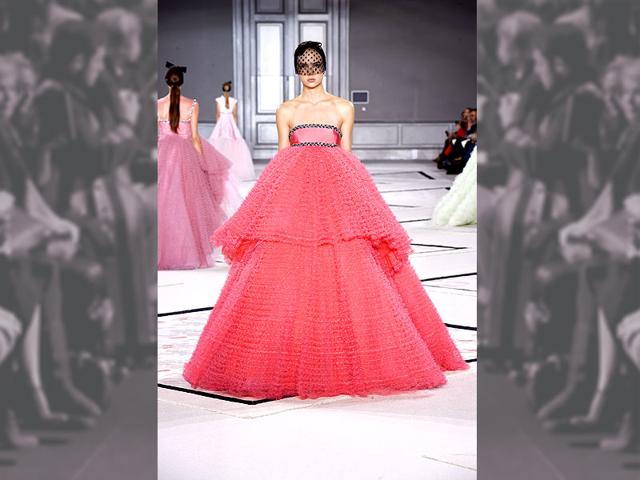 A voluminous coral pink fancy by Giambattista Valli