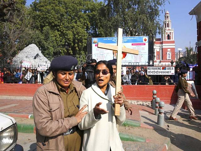 A-policewoman-detains-one-of-the-Christians-protesting-against-recent-attacks-on-churches-outside-the-Sacred-Heart-Church-in-New-Delhi-AP-photo A-policewoman-detains-one-of-the-Christians-protesting-against-recent-attacks-on-churches-outside-the-Sacred-Heart-Church-in-New-Delhi-AP-photo