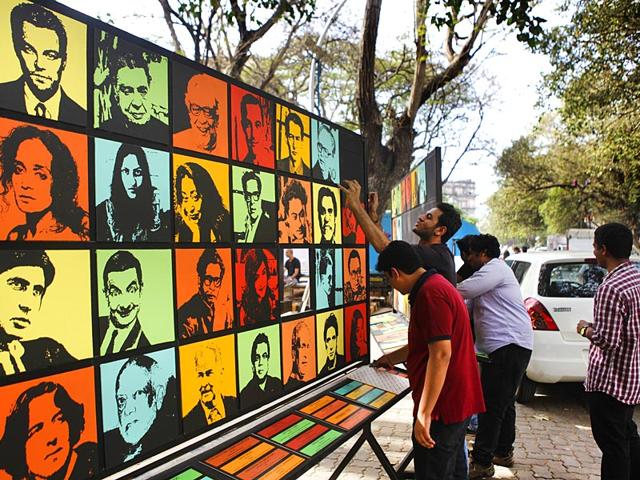 Young volunteers were preparing the art installations a day ahead the Hindustan Times Kala Ghoda Arts Festival 2015 in Mumbai. (Kalpak Pathak/HT photo)