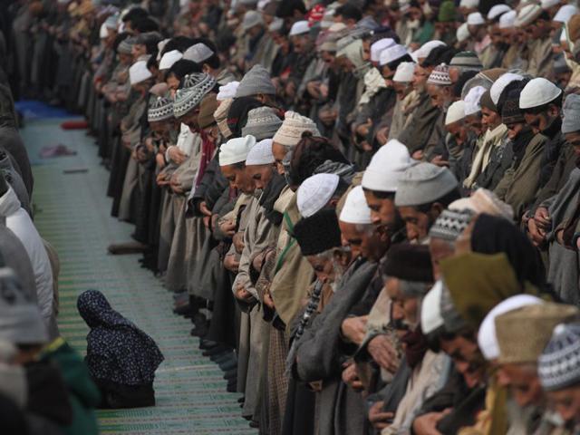 Kashmiri Muslims pray at the shrine of noted Muslim preacher and saint, Sheikh Syed Abdul Qadir Jeelani on Friday. Waseem Andrabi/HT