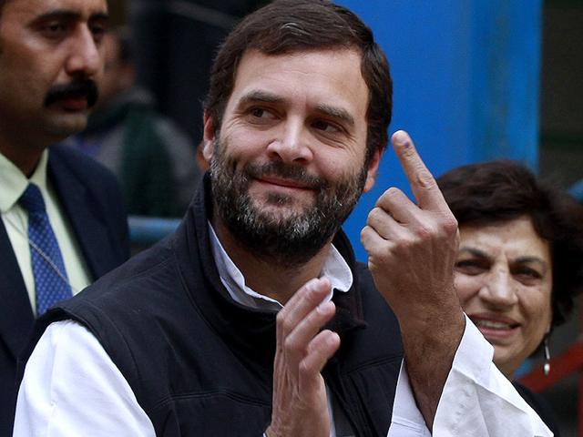 Congress vice-president Rahul Gandhi shows his ink-marked finger after casting his vote at a polling station during the Delhi assembly elections. (HT Photo/Sanjeev Verma)