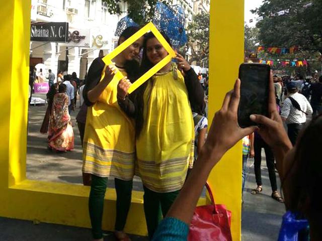 Visitors pose alongwith art installations at the HT Kala Ghoda Arts Festival 2015 in Mumbai. (Kalpak Pathak/HT photo)