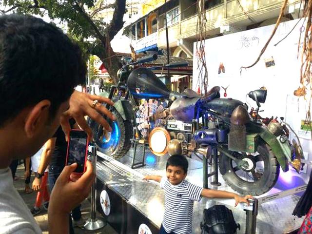 Kids pose next to art installations at the HT Kala Ghoda Arts Festival 2015 in Mumbai. (Kalpak Pathak/HT photo)
