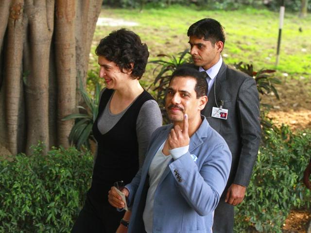 Priyanka Gandhi Vadra and her husband Robert Vadra after casting their vote at a polling station during the Assembly Elections in New Delhi. (Sanjeev Verma/HT Photo)