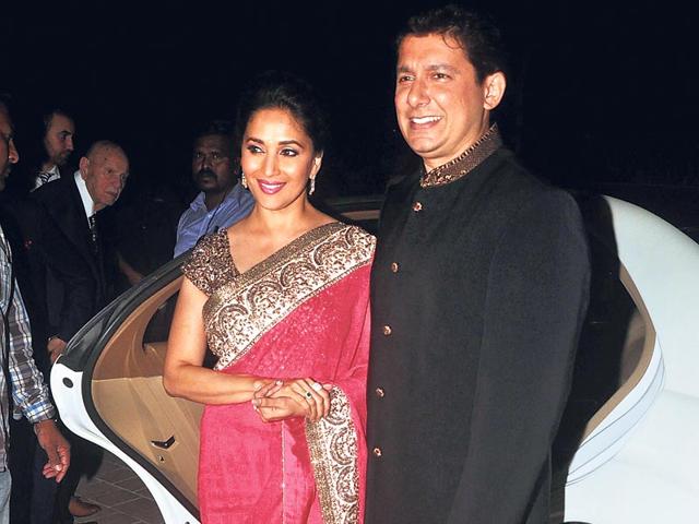 Madhuri Dixit with husband Shriram Nene at a pre-wedding function of businessman Sanjay Hinduja. (HT photo)