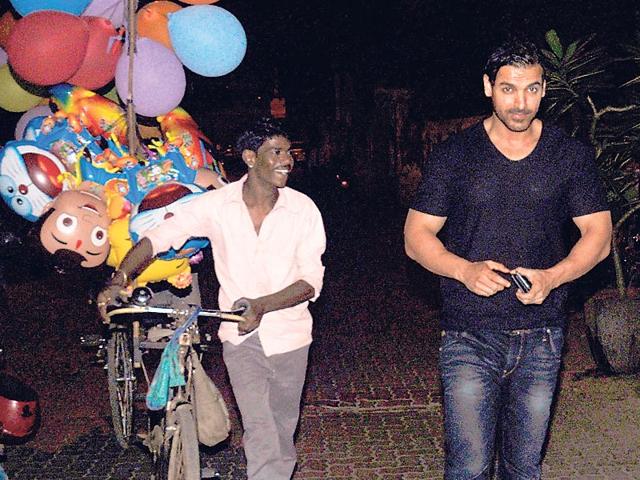 Late at night, a star-struck balloon seller was seen following John Abraham on a street in Mumbai. (HT photo)