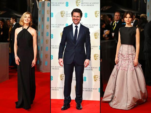 Rosamund Pike (left), Tom Cruise (middle) and Felicity Jones (right) look stunning in black at the red carpet of BAFTA. (AFP)