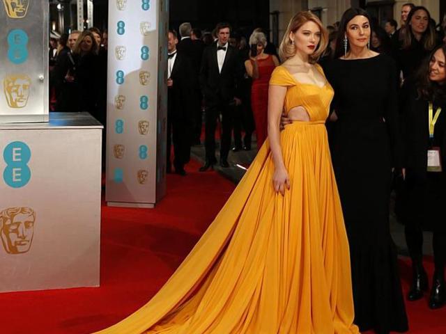 French actor Lea Seydoux (left) and Italian actor Monica Bellucci (right) look extravagent at the BAFTA red carpet. (AFP)