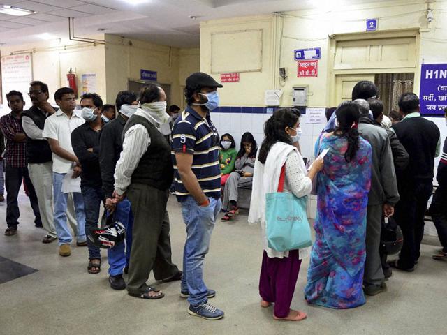 Suspected swine flu patients stand in queue at H1N1 diagnostic centre at Government Jai Prakash Hospital in Bhopal on Monday. (PTI photo)