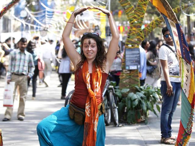 A visitor poses next to an art installation at the HT Kala Ghoda Arts Festival, in Mumbai. (Vidya Subramanian/HT photo)
