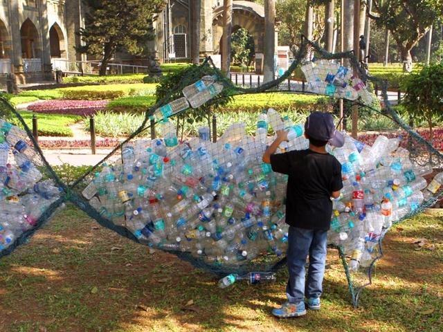 A child watches an art installation in the shape of a fish at the HT Kala Ghoda Arts Festival at the Museum Garden in Mumbai. (Arijit Sen/HT photo)