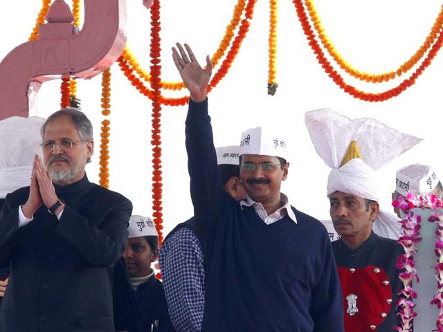 In-this-photo-taken-on-December-28-2013-Delhi-L-G-Najeeb-Jung-and-AAP-leader-Arvind-Kejriwal-share-the-dais-during-the-latter-s-swearing-in-ceremony-at-Ramlila-Maidan-in-New-Delhi-Arvind-Yadav-HT-Photo In-this-photo-taken-on-December-28-2013-Delhi-L-G-Najeeb-Jung-and-AAP-leader-Arvind-Kejriwal-share-the-dais-during-the-latter-s-swearing-in-ceremony-at-Ramlila-Maidan-in-New-Delhi-Arvind-Yadav-HT-Photo