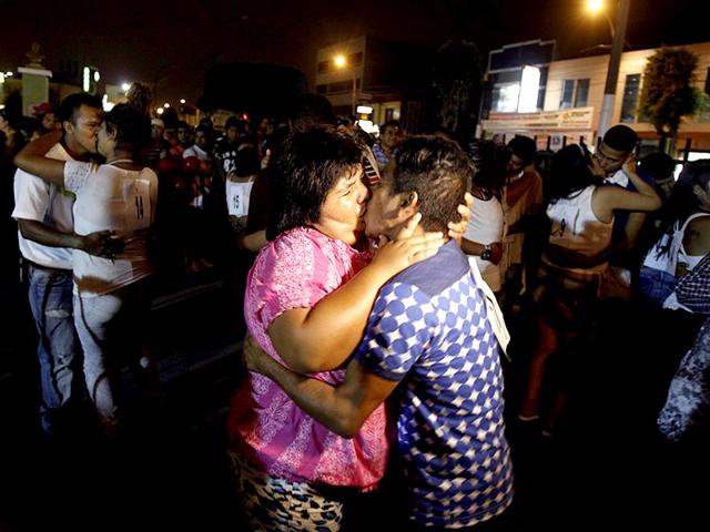 Couples kiss while participating in a longest kiss contest during Valentine's Day celebrations organized by the city hall in Lima's port of Callao. (Reuters)