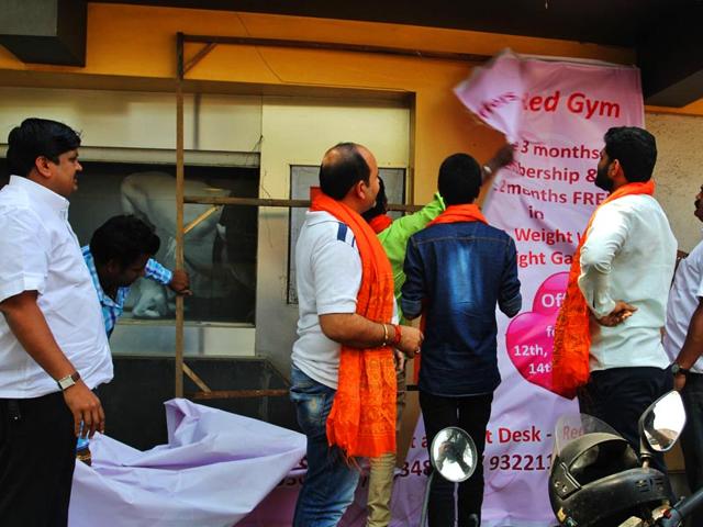 Vishwa Hindu Parishad activists protest against Valentine's Day and burn greeting cards in Thane. (Praful Gangurde/HT photo)