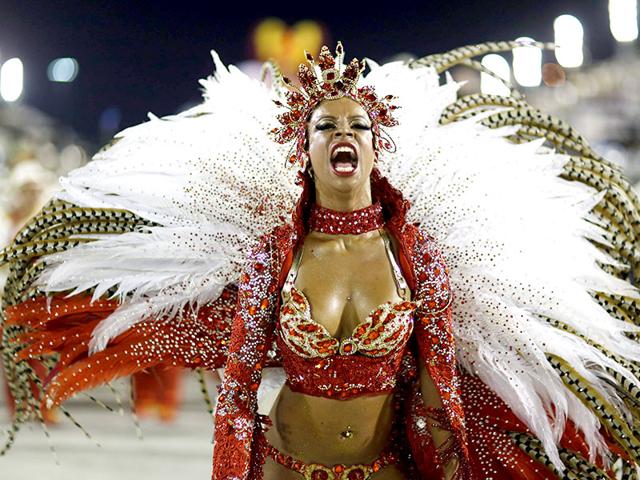 A reveller from the Alegria da Zona Sul samba school takes part in the Group A category of the annual Carnival parade in Rio de Janeiro's Sambadrome. (Reuters)