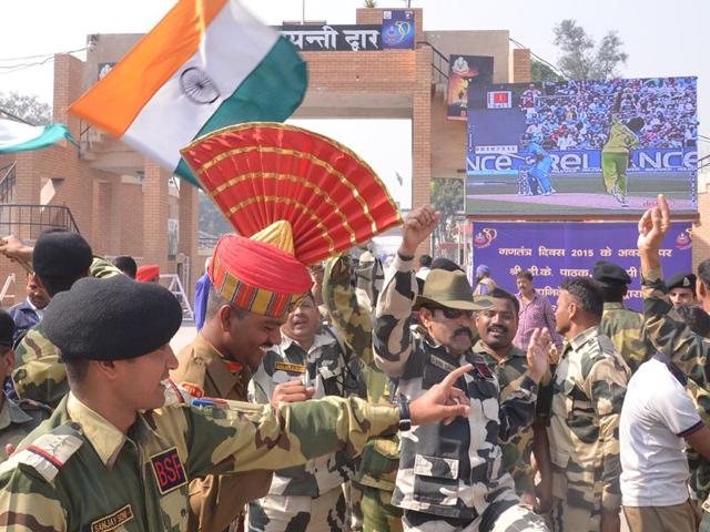 BSF personnel celebrate as they watch a live broadcast of the Cricket World Cup match between India and Pakistan at Border Post in Amritsar. Sameer Sehgal/HT