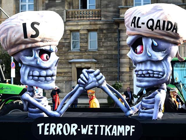 Figures depicting IS and al Qaeda are pictured reading 'terror competition' during the traditional Rose Monday carnival parade in the western German city of Duesseldorf. (AFP Photo)