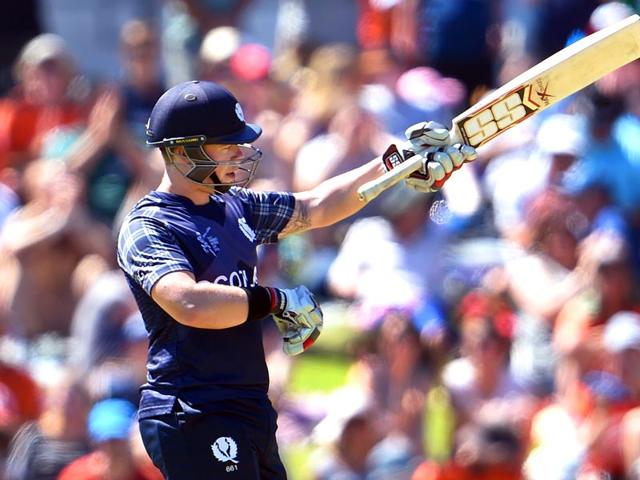 Scotland batsman Matt Machan acknowledges the applause after reaching his half century. (AFP Photo)