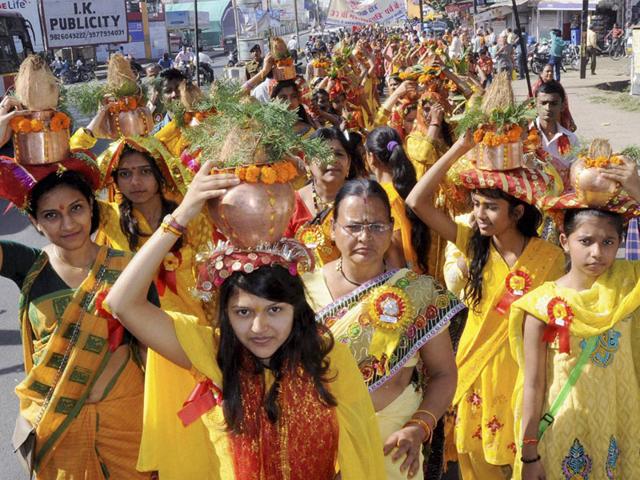 Women devotees take out traditional 'Kalash Yatra' on the occasion of Mahashivratri, in Bhopal on Tuesday. (PTI photo)