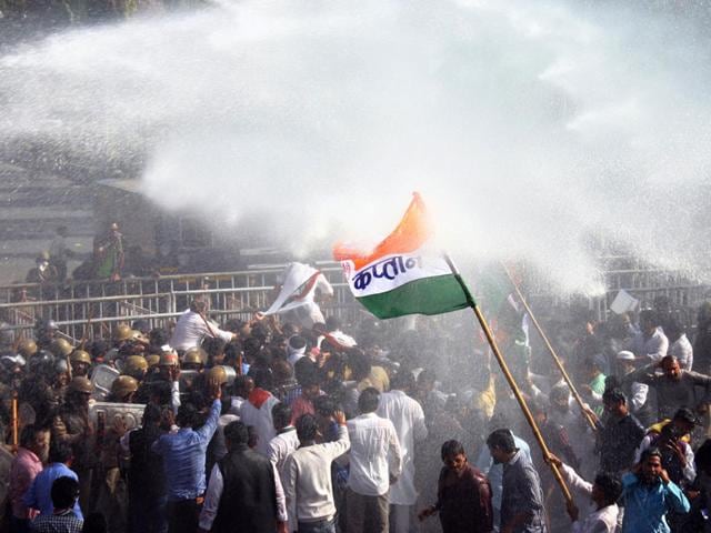 Bhopal police use water cannons to disperse Congress workers when they gathered to stage a demonstration against PEB scam in Bhopal on Wednesday. (Bidesh Manna/HT photo)