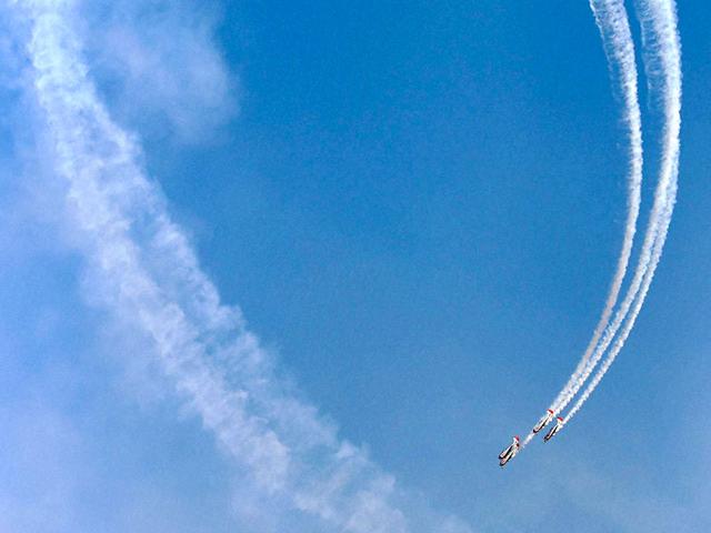 Russia's aerobatic display team " Yakovlevs" in action at the AERO INDIA 2015. (PTI Photo)