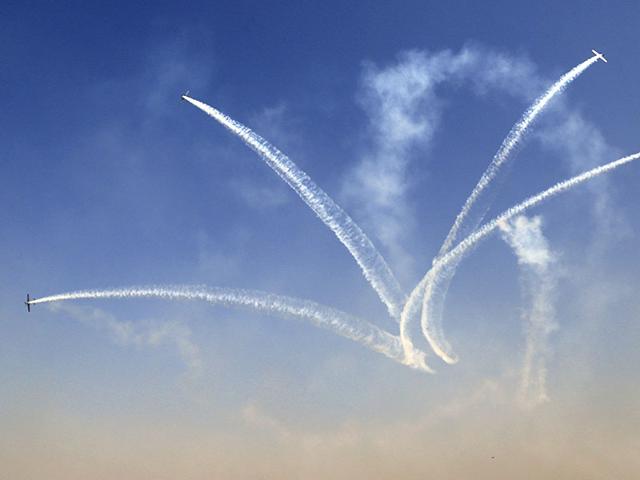 Russian aerobatic team Yakovlev performs at the inaugural function of Aero India 2015. (AP Photo)